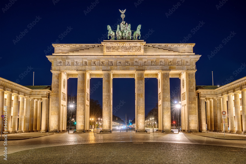 The famous illuminated Brandenburg Gate in Berlin at night