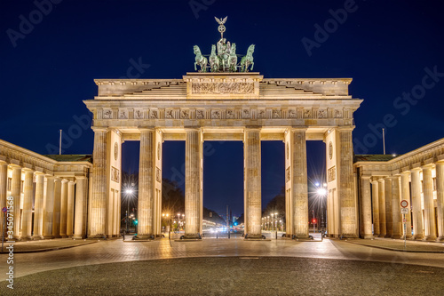 The famous illuminated Brandenburg Gate in Berlin at night photo
