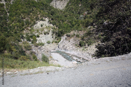 Mountainous road leading to Lahic village in Ismayilli region of Azerbaijan, with car. photo