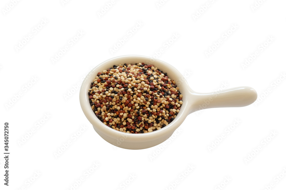 Quinoa seeds in the white cup isolated on white background. Quinoa is a good source of protein for people following a plant-based diet. Quinoa seeds in the white cup isolated on white background. Quinoa is a good source of protein for people following a plant-based diet.