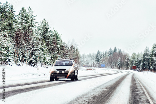 Car at winter road in Rovaniemi of Lapland Finalnd