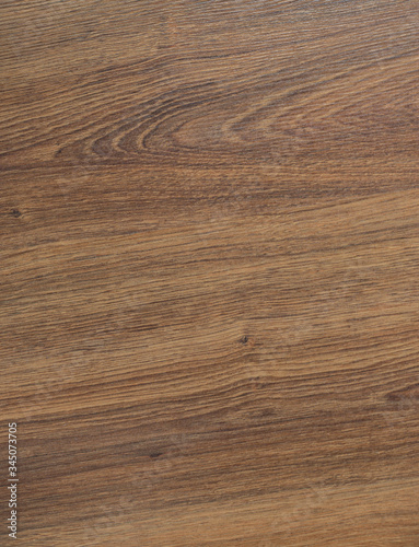 Wooden brown textured floor or desk background and texture of Walnut wood decorative furniture surface