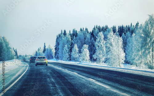 Car in winter road at Rovaniemi at Lapland Finalnd reflex © Roman Babakin