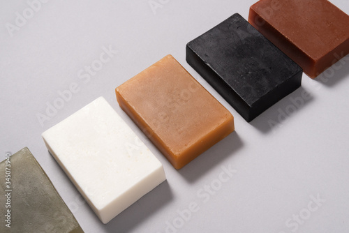 Set of different handmade soap on black background, mock up photo