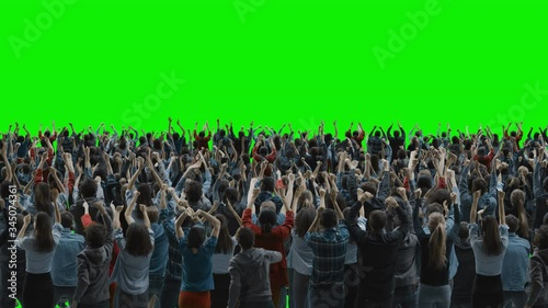 Green Screen: Crowd of People Having Fun, Cheering, Applauding, Celebrating at Sport Event, Concert, Festival, Party. Back View. Chroma Key, Black Screen, Silhouette White People on Black Background photo