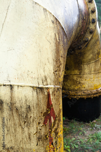Wallpaper Mural Yellow dirty pipe (tube). Red arrow on the pipe. Torontodigital.ca