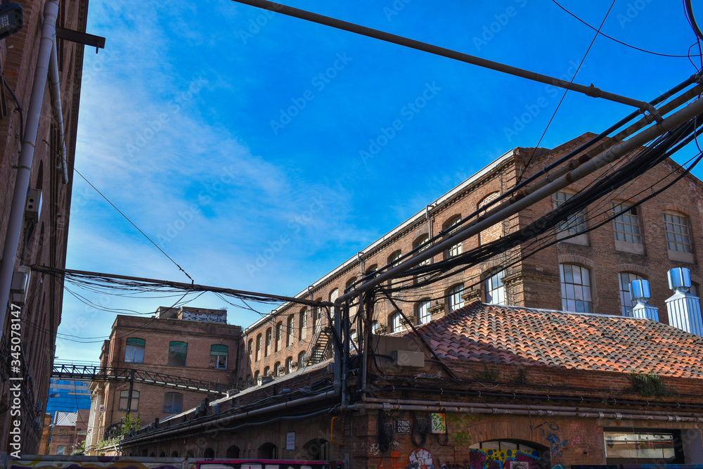 Old abandoned factories with hanging power cables