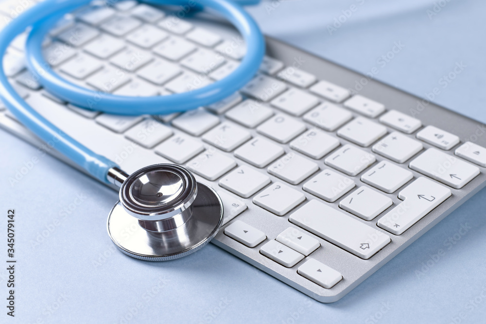 Closeup of a computer keyboard and stethoscope. Closeup of a computer keyboard and stethoscope.