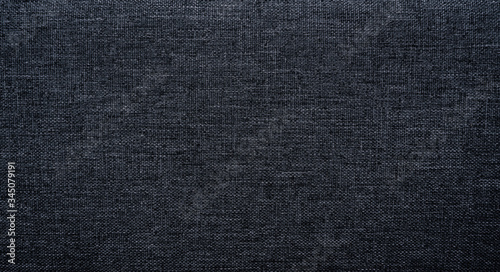 Canvas Polyester texture synthetical for background. Black polyester fabric textile backdrop for interior art design or add text message. © pattanawit