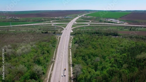 Circular aerial top-down shots of vehicles circling a lane, cars and trucks. 4K