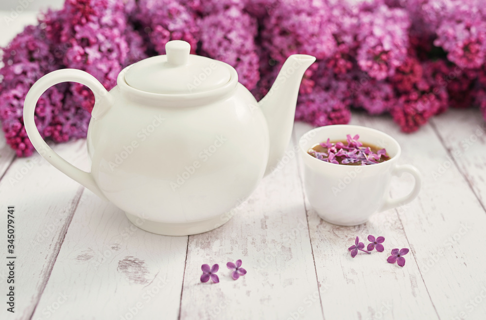 Good morning concept. Cozy morning. Tea set and lilac flowers. Happy birthday greeting card. Hello spring and summer. Greeting card for Women's Day and Mother's Day. Spring season, copy space Good morning concept. Cozy morning. Tea set and lilac flowers. Happy birthday greeting card. Hello spring and summer. Greeting card for Women's Day and Mother's Day. Spring season, copy space