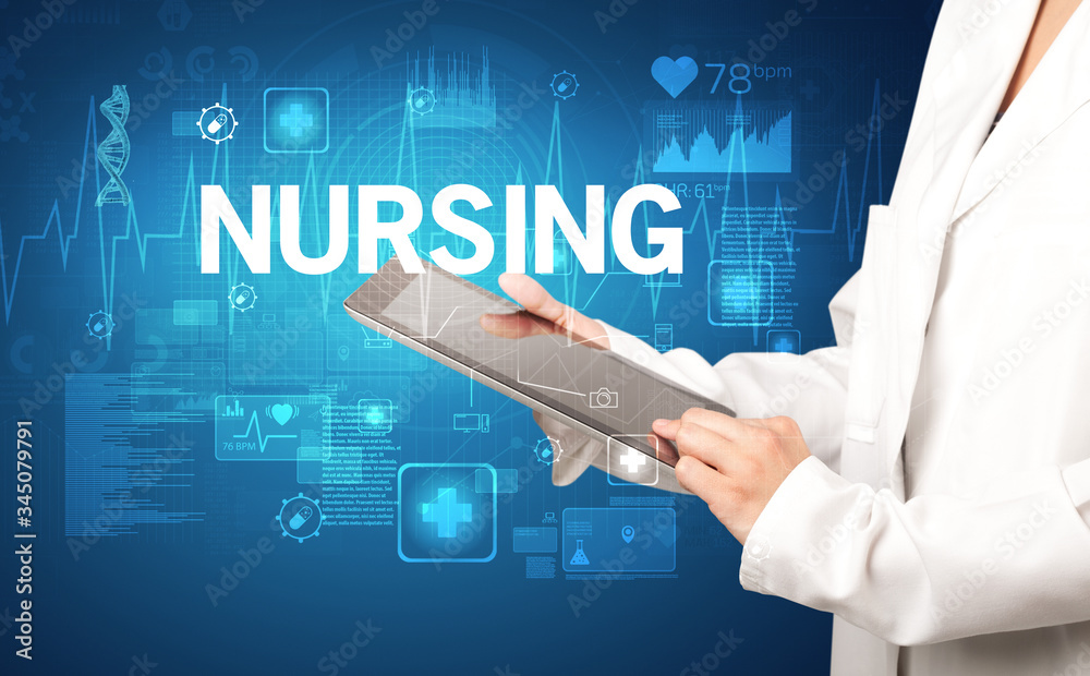 young doctor writing down notes with NURSING inscription, healthcare concept young doctor writing down notes with NURSING inscription, healthcare concept