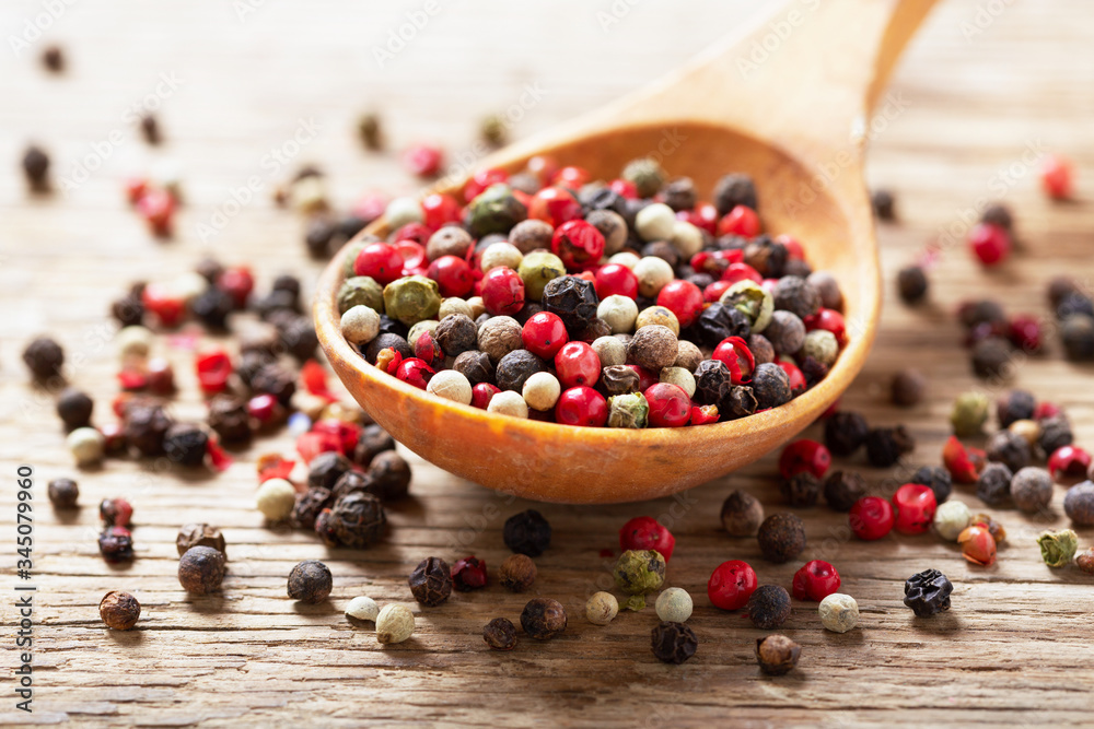 mixed of peppercorns in a spoon mixed of peppercorns in a spoon
