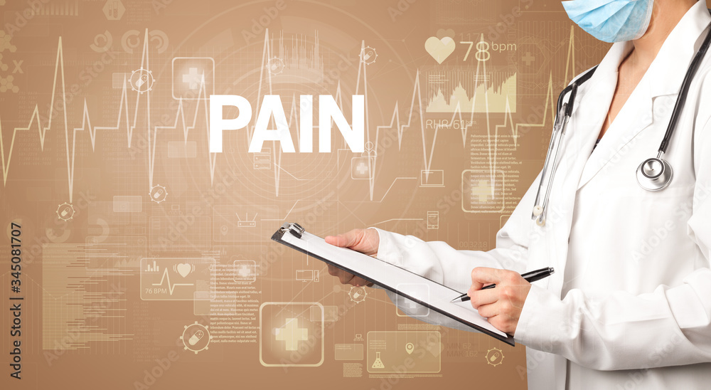 young doctor writing down notes with PAIN inscription, healthcare concept