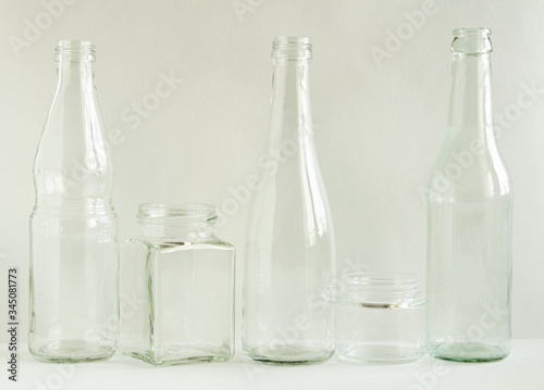 Glass bottles and jars, washed and clean, are ready to be recycled. Garbage for recycling. Glass for recycling