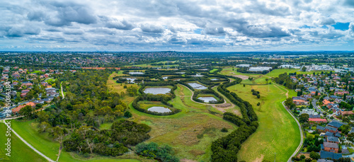 Scenic Tirhatuan Wetlands near suburban areas in Melbourne, Australia - wide aerial panorama