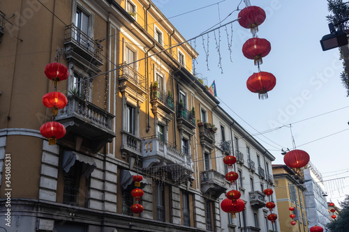 Quadro su tela Old houses and red lanterns along via Sarpi in Milan