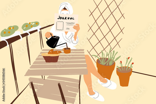 Woman having a breakfast on the balcony