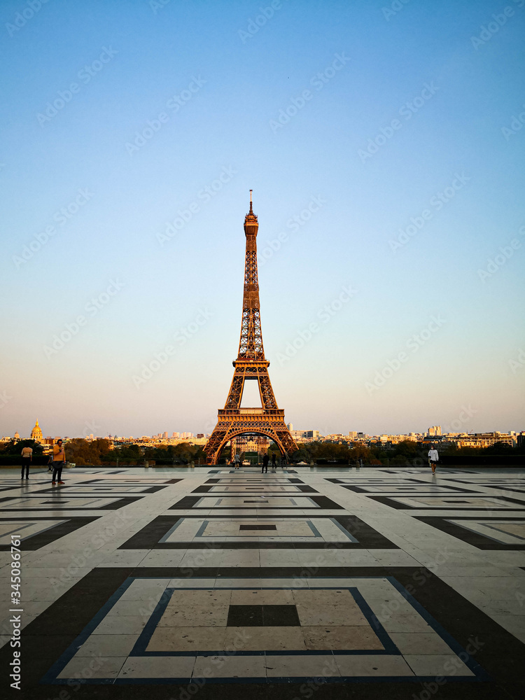 Empty Eiffel Tower and Trocadero during the French national lockdown because of the Covid-19 pandemic with sunset