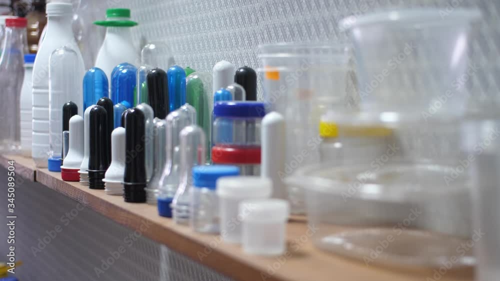 Sample of Plastic Bottle Part from PET Preform Injection Molding Machine on Shelves, Polyethylene Terephthalate Sample of Plastic Bottle Part from PET Preform Injection Molding Machine on Shelves, Polyethylene Terephthalate