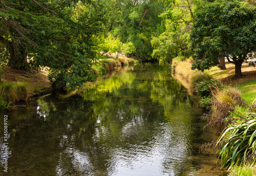 The Avon River running through Hagley Park in Christchurch in New Zealand. 