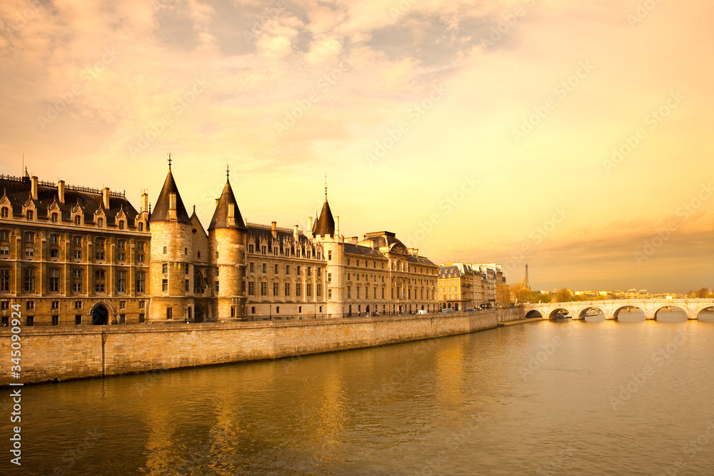 The Conciergerie at Justice Palace and Pont Neuf Bridge over the Seine River, Ile de la Cite, Paris, France