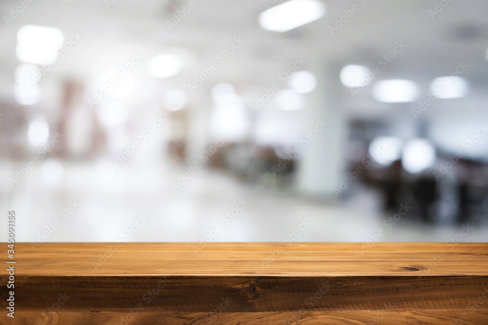Empty wooden table and blurry background of white bokeh light department store for product display montage. Empty wooden table and blurry background of white bokeh light department store for product display montage.
