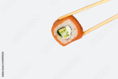 Philadelphia roll on a white background, isolated. Close-up