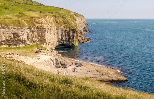 Obraz na płótnie Looking East along the Jurassic Coast with the famous Dancing Ledge near Langton Matravers, Swanage, Dorset, UK on a warm and sunny Summer afternoon w salonie