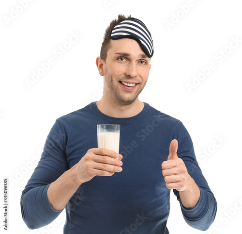 Young man with glass of mil...