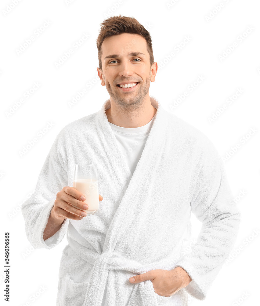 Young man with glass of milk on white background Young man with glass of milk on white background