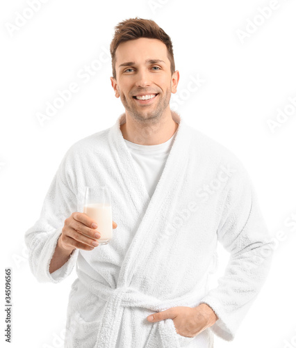 Young man with glass of mil...