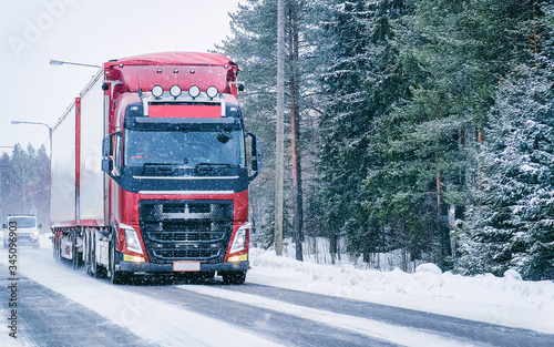 Truck on the Snowy winter Road in Finland in Lapland reflex