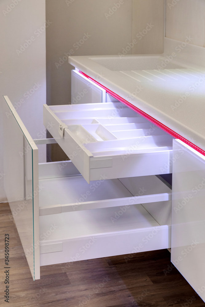 Fototapeta premium a kitchen interior with drawers