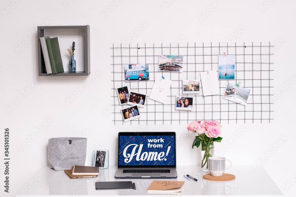 Workplace of contemporary designer by wall of domestic room or home office Workplace of contemporary designer by wall of domestic room or home office