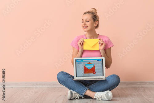 Young woman with letter and...