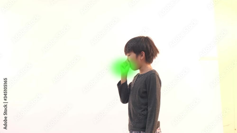 4k Young Asian boy got cough on white background with a green fog effect 4k Young Asian boy got cough on white background with a green fog effect