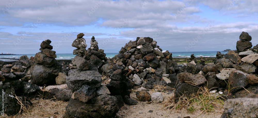 Wish rock blocks made by people on the shore of a beach