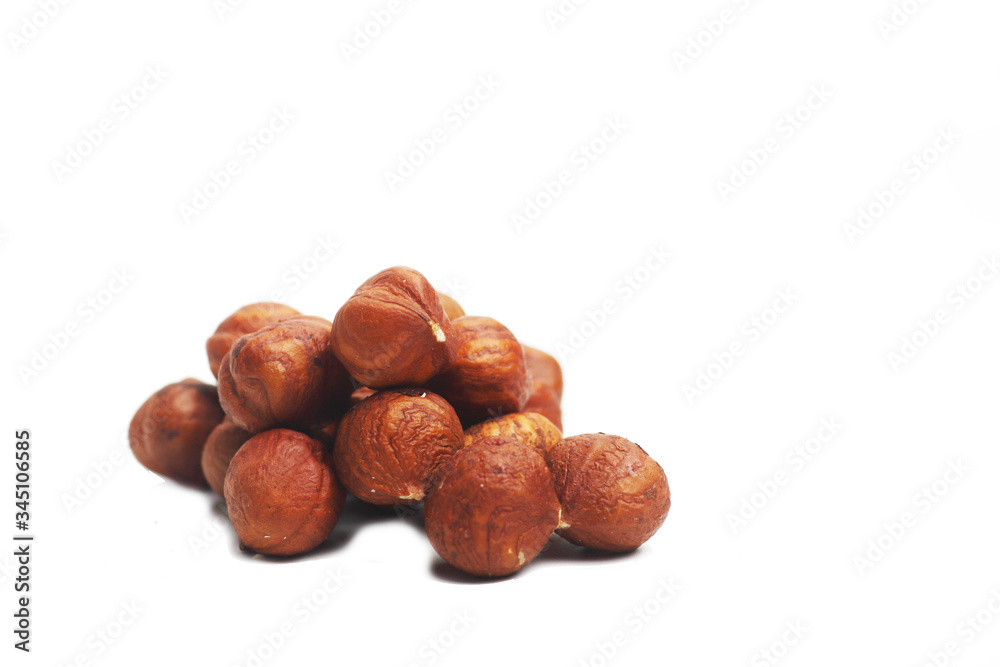 A pile of hazelnut isolated on white background. Image contains copy space A pile of hazelnut isolated on white background. Image contains copy space