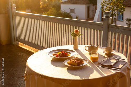 Bellissima tavola imbandita con la colazione Italiana in un balcone  photo