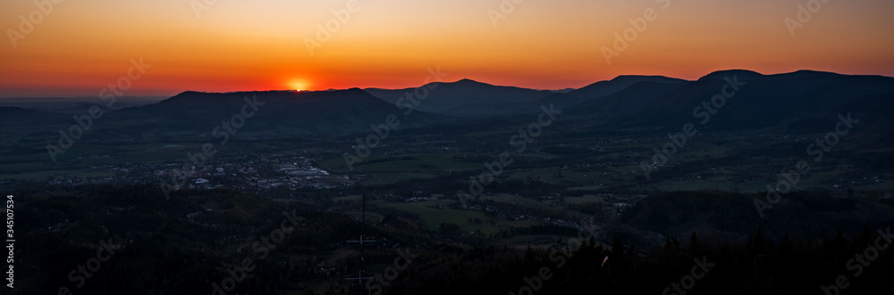 sunrise over the mountains with a silhouette of the landscape