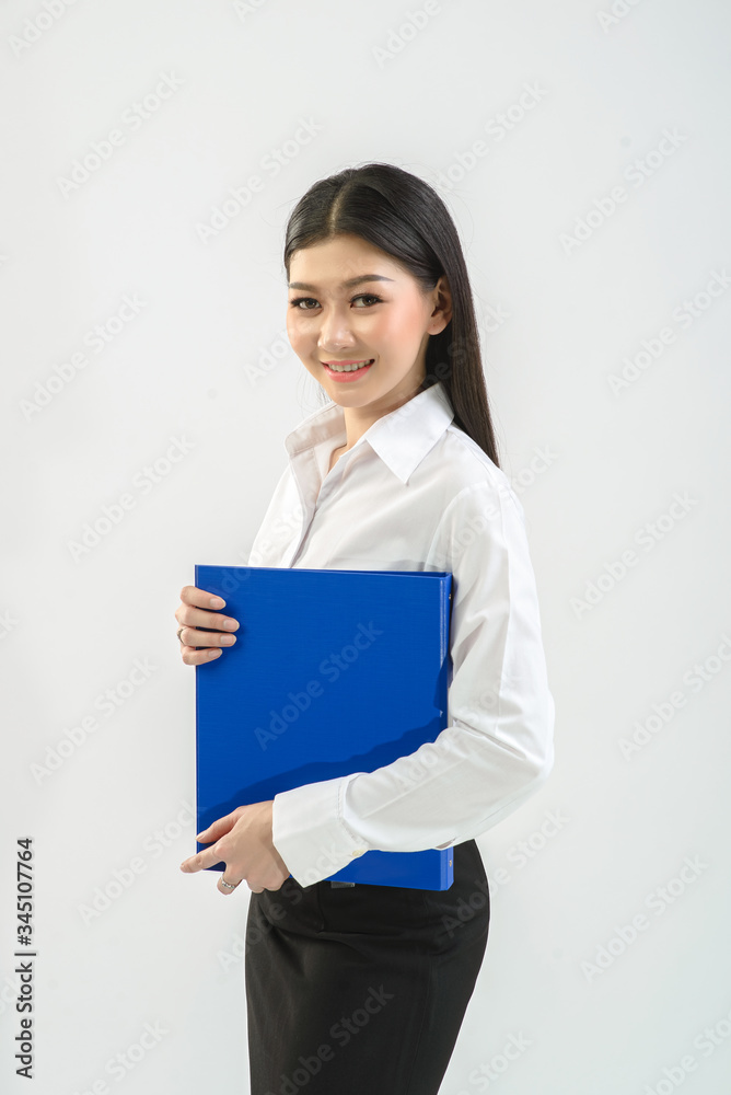 Office girl, company staff holding files and checking work from files on white background. Business, online trading, presenter concept. Office girl, company staff holding files and checking work from files on white background. Business, online trading, presenter concept.