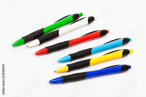 Color ballpoint pens on awhite background