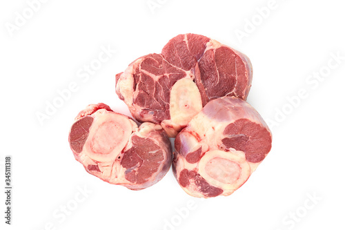 Three slices of fresh shank steak on a white background. Fresh Osso Buco steaks. The view from the top.