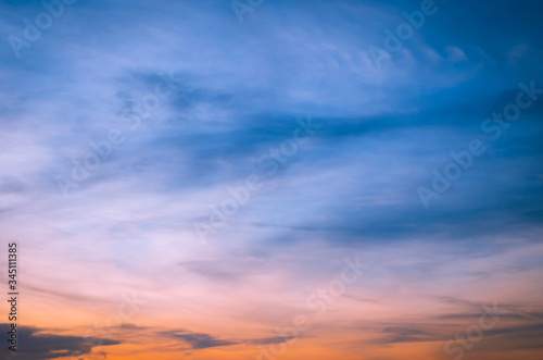 Sunset in the clouds in the form of tracks Sunset light Clouds in the form of long orange stripes in the sky