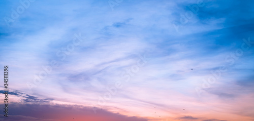 Sunset in the clouds in the form of tracks Sunset light Clouds in the form of long orange stripes in the sky