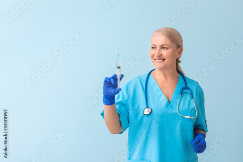 Mature female doctor with s...