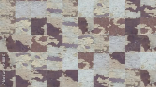 Abstract video of mosaic textures from elements of an old wooden board in white frayed paint. Background design. Backdrop. Wallpaper.