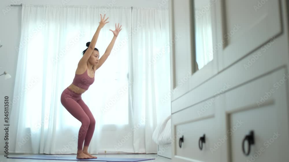 4k Young woman practice yoga in a bedroom in a morning 4k Young woman practice yoga in a bedroom in a morning
