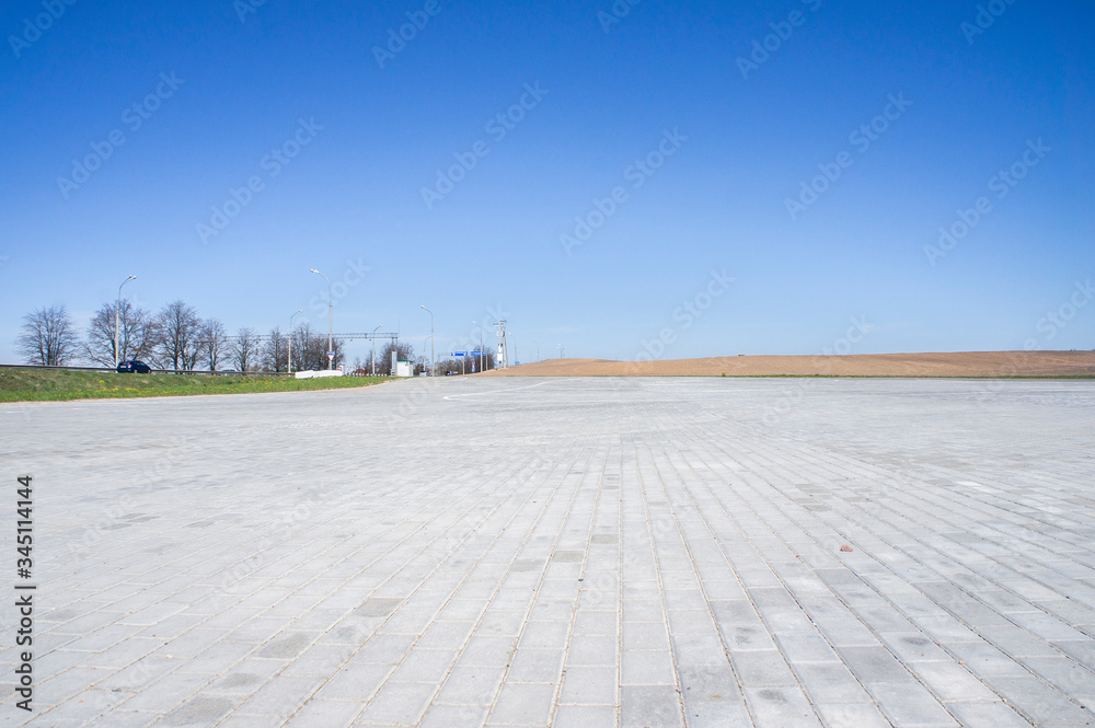 Empty asphalt parking in summer in a southern country